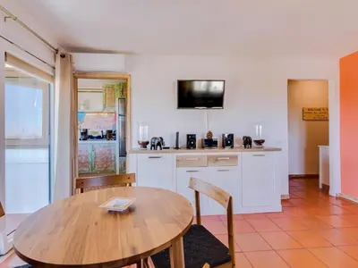 a white bed in a white room with a window at AL - Apartamento Algardia Mar in Vilamoura