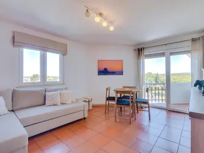 a kitchen with a counter with a microwave on it at AL - Apartamento Algardia Mar in Vilamoura