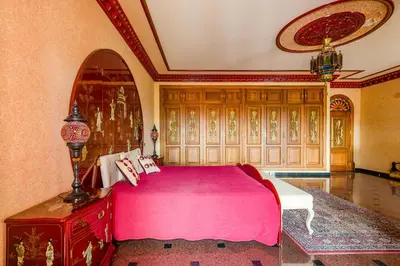 a bedroom with a pink bed in a room at Quinta do Galvao - Luxury Villa by HD PROPERTIES in Quarteira