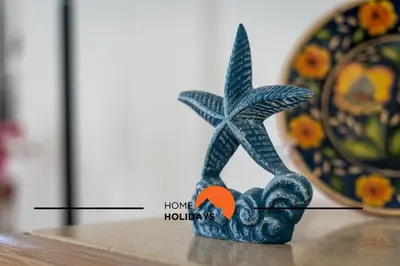 a figurine sitting on top of a table at #174 T2 em Zona Tranquila by Home Holidays in Albufeira
