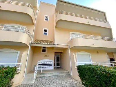 a facade of a building with balconies and bushes at Vilamoura Typical 2 With Pool by Homing in Vilamoura