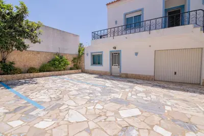 a stone patio in front of a house at Casinha I by Innkeeper in Guia