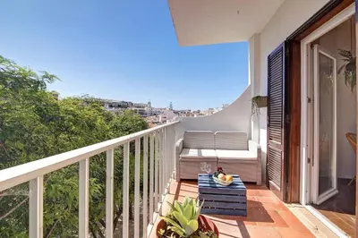 a balcony with a table and a bench on it at Hanna's Sunny Apartment in Albufeira