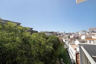 a view of a city from a balcony at Hanna's Sunny Apartment in Albufeira