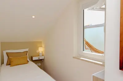 a bedroom with a bed and a window with a view at Marina Vista Sol-CleverDetails, Marina view, sleeps 2 adults and 2 children in Vilamoura