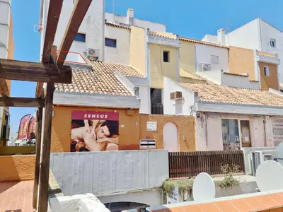 a building with a billboard on the side of it at Marina Vista Sol-CleverDetails, Marina view, sleeps 2 adults and 2 children in Vilamoura