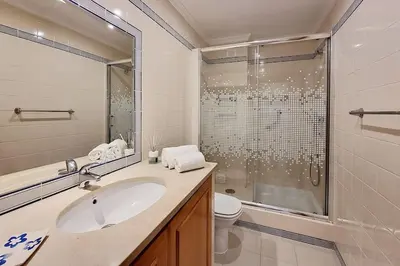 a bathroom with a sink and a shower at Sea Beside in Albufeira