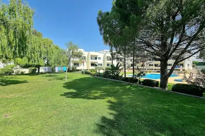 a large yard with a building and a swimming pool at Sea Beside in Albufeira