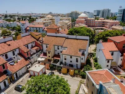 an aerial view of a beach and the ocean at Villa Amour Charming Duplex Apartment on Marina in Quarteira