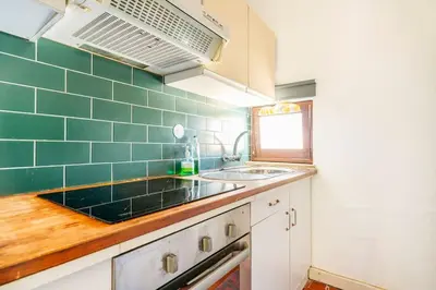 a kitchen with a sink and a counter at Sunny Villa with golf front view in Vilamoura