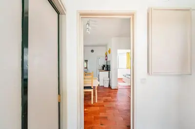 a view of a hallway with a kitchen and a dining room at Sunny Villa with golf front view in Vilamoura