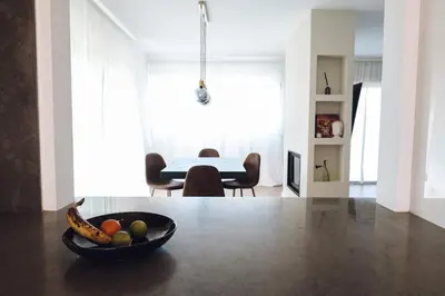 a bowl of fruit sitting on a table in a living room at CASA AMOR JACARANDA - Ocean View Modern Vila in Albufeira