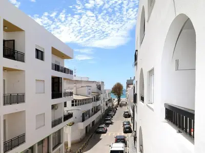 a view of a street between two buildings at Mar á vista by FHR 2 minutos á praia in Quarteira