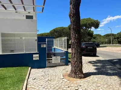 a living room and dining room with a table and chairs at Anzol By FHR in Quarteira