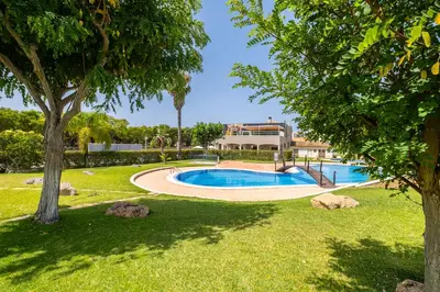 a swimming pool in a yard with trees at Villa Arrifes by Atlantic Places in Albufeira