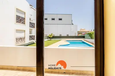 a view from the window of a house with a swimming pool at #180 T2 Ondas do Mar by Home Holidays in Albufeira