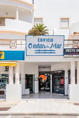 a building with a sign for aiman marcus at #180 T2 Ondas do Mar by Home Holidays in Albufeira