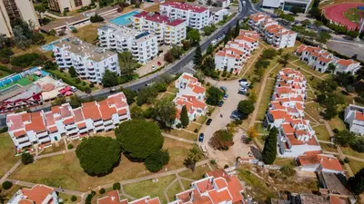 an aerial view of a city with buildings and trees at 2 BDR Vilamoura Escape W Balcony by LovelyStay in Quarteira