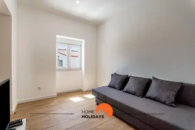 a living room with a couch and a window at #178 Monte das Churras 1 by Home Holidays in Albufeira