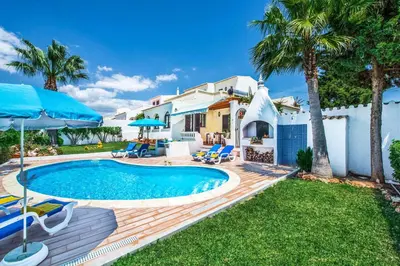 a villa with a swimming pool and a house at Villa Toad Hall in Galé