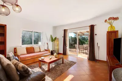 a living room with a couch and a table at Casa Palma in Paderne