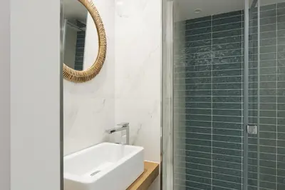 a bathroom with a sink and a mirror at Miral 5 Sea front by HD Properties in Quarteira
