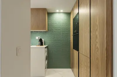 a small bathroom with a green wall at Miral 5 Sea front by HD Properties in Quarteira