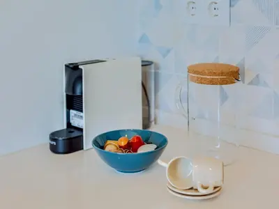 a bowl of vegetables on a counter next to a blender at AL - Vilamoura Algardia in Vilamoura