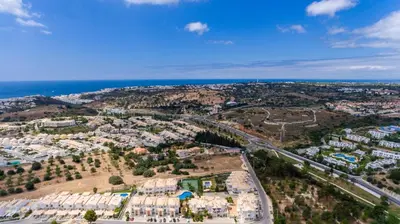 an aerial view of a city with the ocean at Villa Albufeira by Atlantic Places in Albufeira