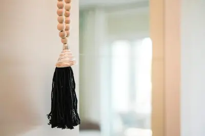 a black tassel hanging from a wall at Apartament Belharucas, 400 meters from beach in Albufeira