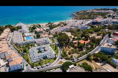 an aerial view of a city with buildings and the ocean at Ocean Oasis by LovelyStay in Albufeira