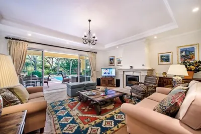 a living room filled with furniture and a fireplace at Villa Plaza - beautiful spacious house off roundabout 6 Quinta Do Lago in Quinta do Lago