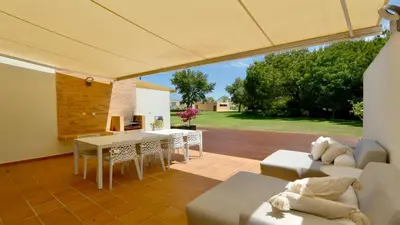 a living room with a couch and a table at Vila Mitri, Monte laguna-CleverDetails, 5 bedroom villa, sleeps 8 adults 2 children in Vilamoura