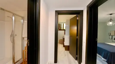 a bathroom with a shower and a bedroom at Vila Mitri, Monte laguna-CleverDetails, 5 bedroom villa, sleeps 8 adults 2 children in Vilamoura
