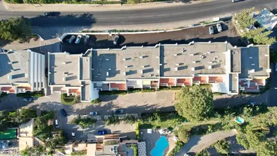 an overhead view of a building with a parking lot at Estudio Balaia by Villas Key in Albufeira