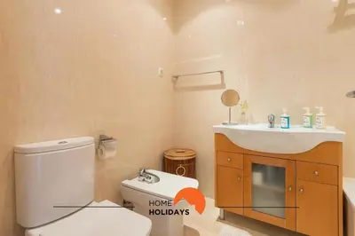 a bathroom with a toilet and a sink at #154 V2 Vila Branca 54 by Home Holidays in Albufeira