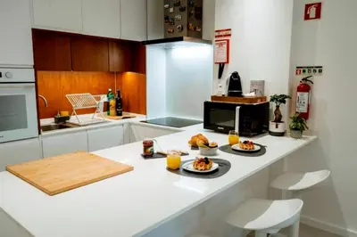 a kitchen with two plates of food on a counter at Sunlight Albufeira by Sunnyway in Albufeira