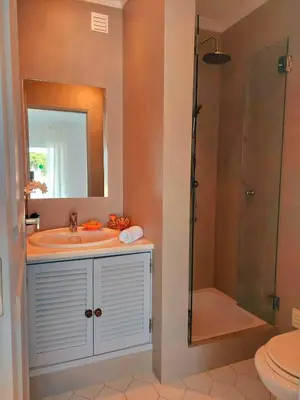 a bathroom with a sink and a shower and a toilet at Seaside SunFlower in Quinta do Lago