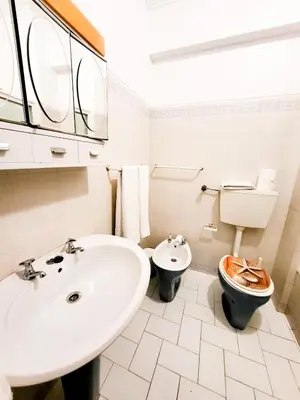 a bathroom with a sink and a toilet at T1 Largo Frente - Familiar in Quarteira