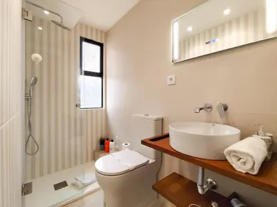 a bathroom with a sink and a toilet and a shower at Solar dos Pinheiros in Vilamoura