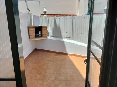 a hallway with a clock on a white wall at SEAVIEW ALBUFEIRA in Albufeira