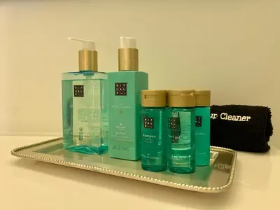 a tray with four bottles of cleaning products on it at Marina Walk Apartment in Vilamoura