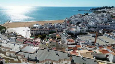 an aerial view of a city and the ocean at T3 Centro de Albufeira com piscina in Albufeira