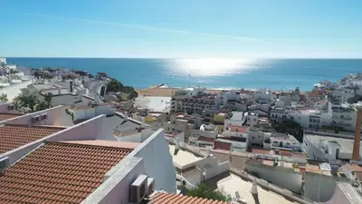 an aerial view of a city with the ocean at T3 Centro de Albufeira com piscina in Albufeira