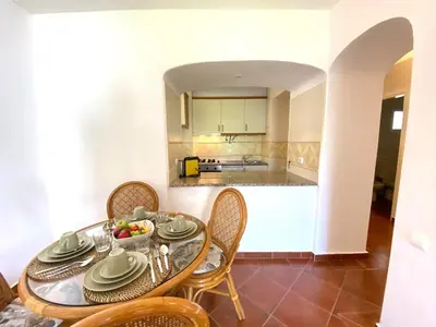 a bathroom with a toilet and a glass shower at Albufeira Quinta da Balaia Garden by Homing in Albufeira