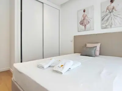 a white bed with two towels on top of it at Vistas Mar Villas D by Stay ici Algarve Holiday Rental in Albufeira