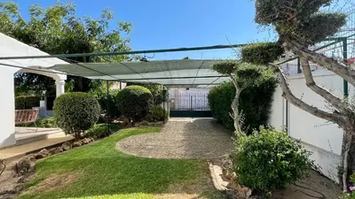 a garden with a walkway leading to a house at Poço by Check-in Portugal in Albufeira
