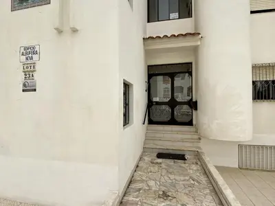 a front door of a white building with a entrance at Albufeira Central 6 by Homing in Albufeira