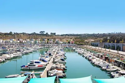 a bunch of boats docked in a harbor at Apartamento W Marina by Sunnyway in Albufeira