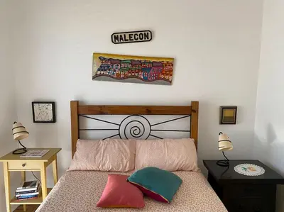 a bedroom with a bed and a sign on the wall at Superstar terrace in Faro